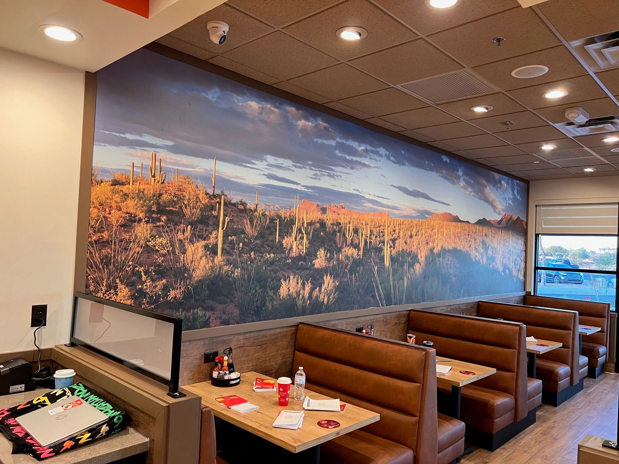 Restaurant interior with desert mural